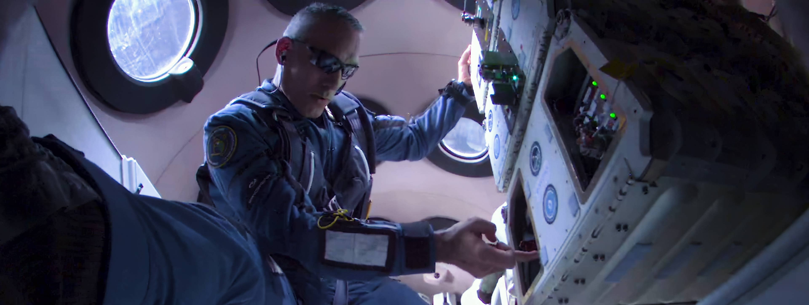 Astronaut working in suborbital space lab